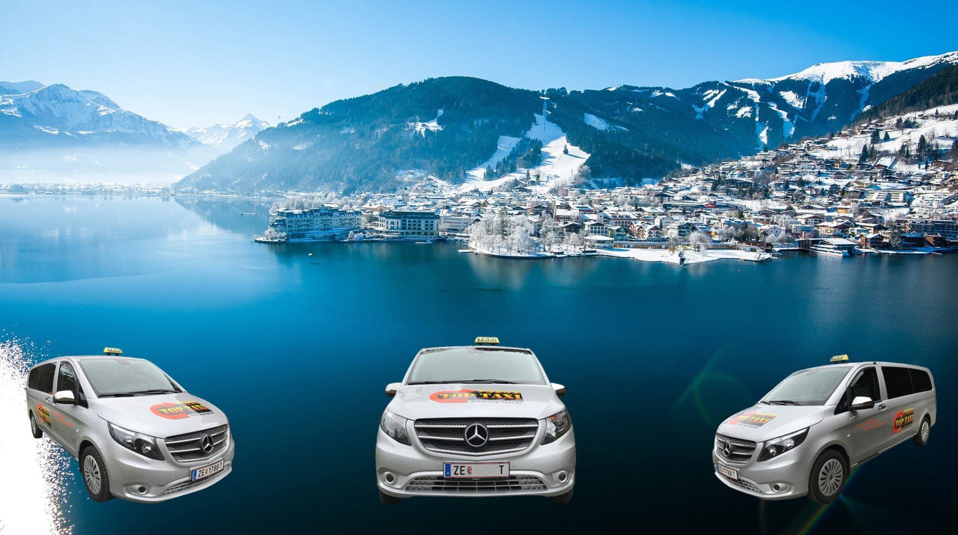 Reihe von TOP TAXI Mercedes-Vans und -Limousinen mit den Bergen von Zell am See im Hintergrund
