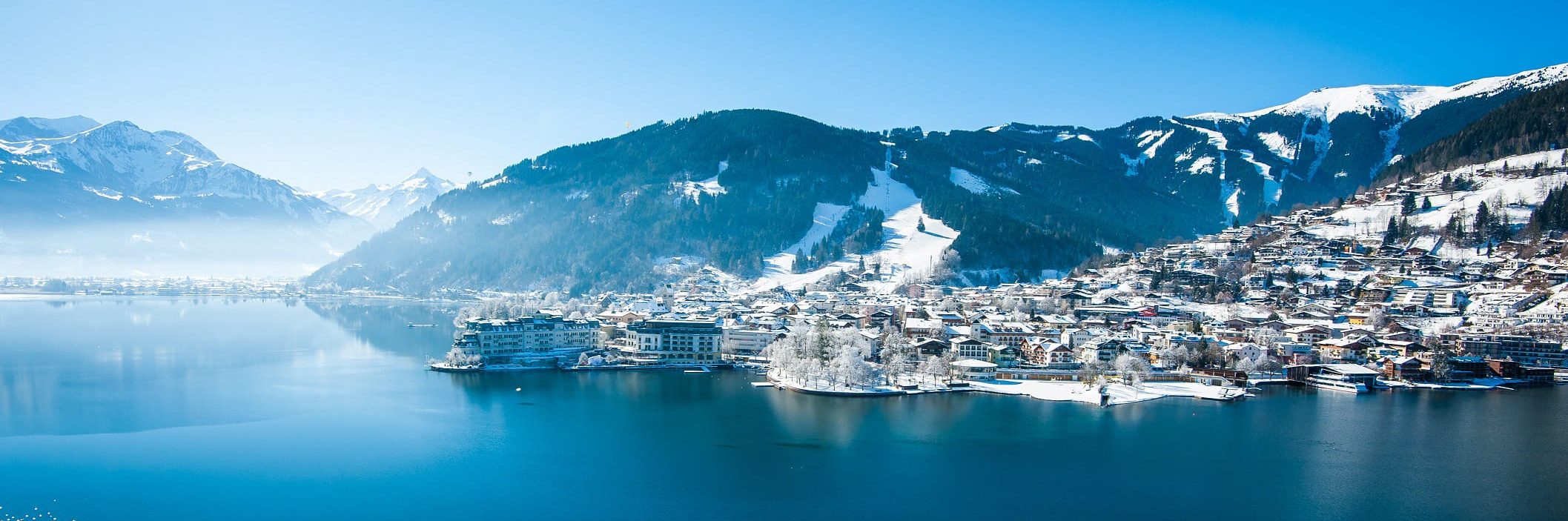 Taxi Zell am See against a snowy mountain backdrop